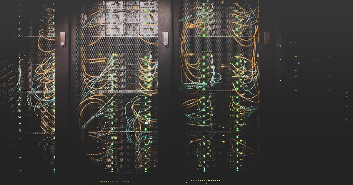 Server room with blue lighting representing cloud infrastructure architecture